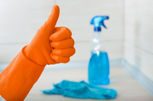 Technician performing deep carpet cleaning in an office